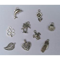 Bedeltjes - bedels - 9 stuks - zilverkleurig - sieraden maken - hobby - creatief - armband - oorbellen - zelf maken - bloem - schildpad - palmboom - klavertje 4 - dolfijn - schelp - slipper - blaadje