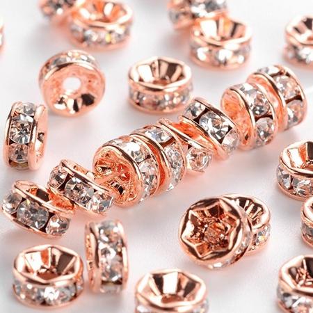 Rhinestone spacer beads, rose goud met heldere chatons, 4x2mm. Verkocht per 20 stuks !