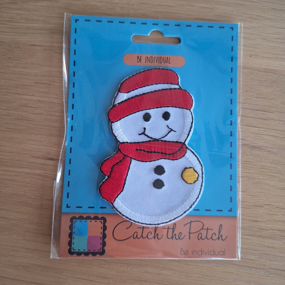 Sneeuwpop strijkembleem