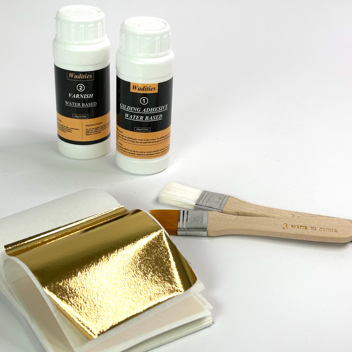 MGM Trading - Gouden Bladfixeerset - Waterbasis - 100 ml Lijm en 100 ml Lak - Inclusief 100 Bladgoud en 2 Penselen - Geschikt voor Knutselen - Schilderen - Professioneel Creatief Gebruik