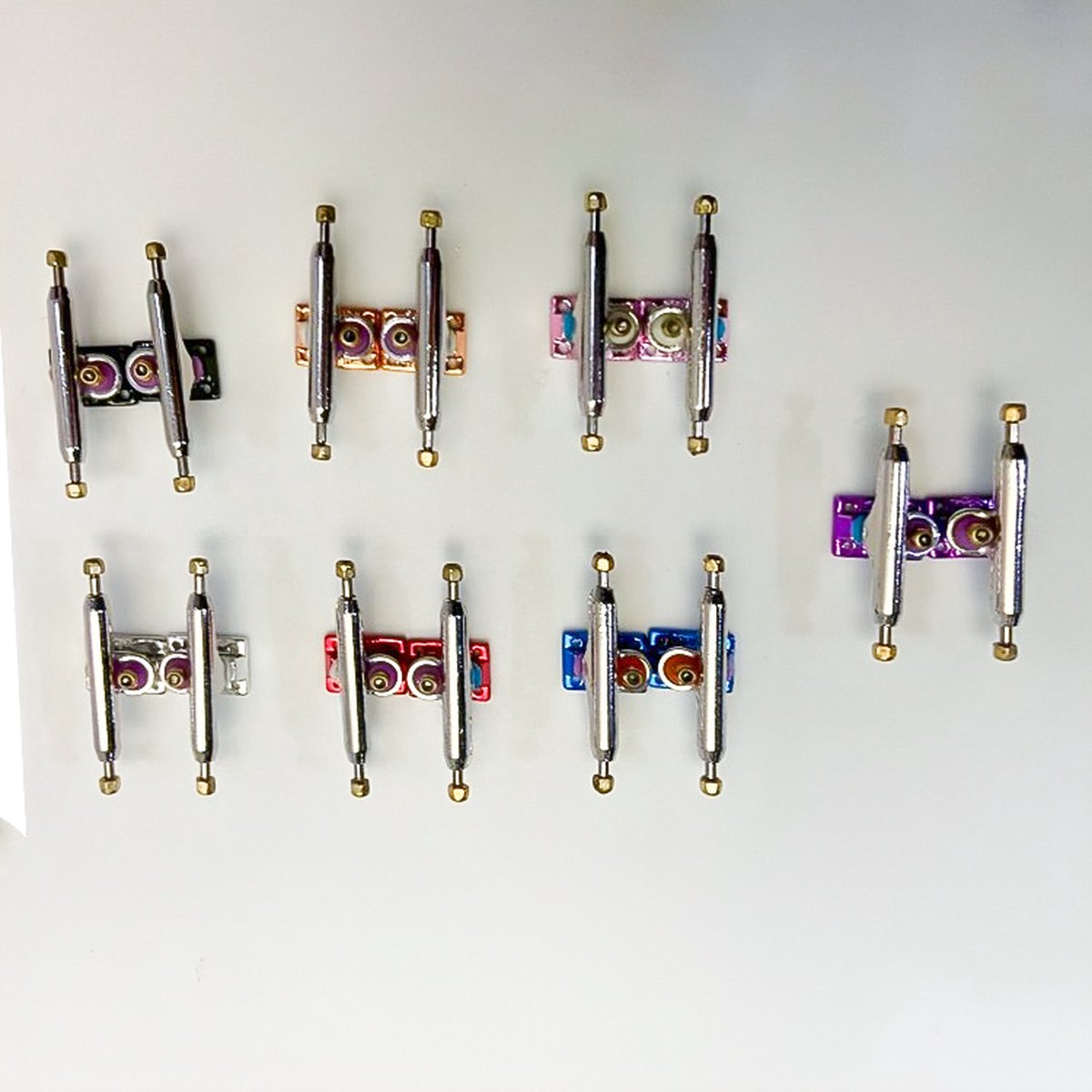 Vinger skateboard truck (RVS) Geel