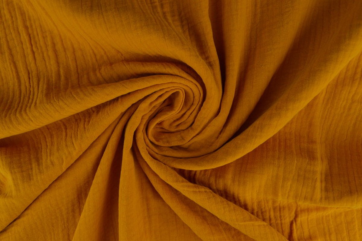 10 meter mousseline stof op rol - Okergeel - 135cm breed - Double gauze op rol