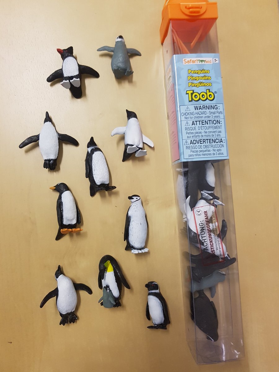 Tube met 10 mini figuren penquins ass