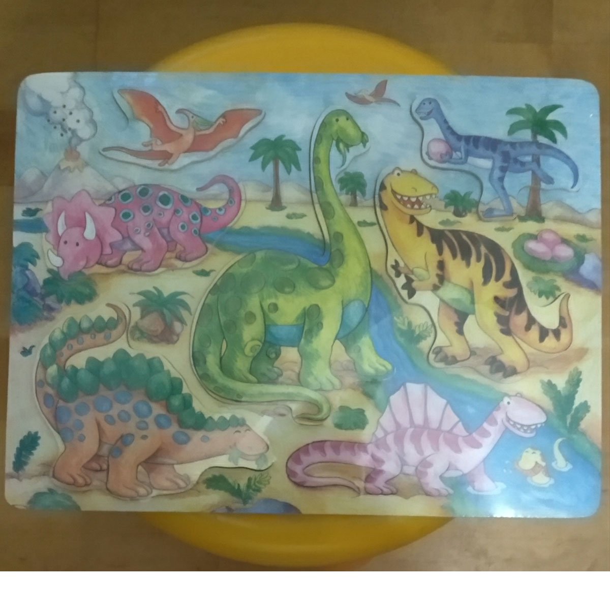 Puzzel dino met houten stukken