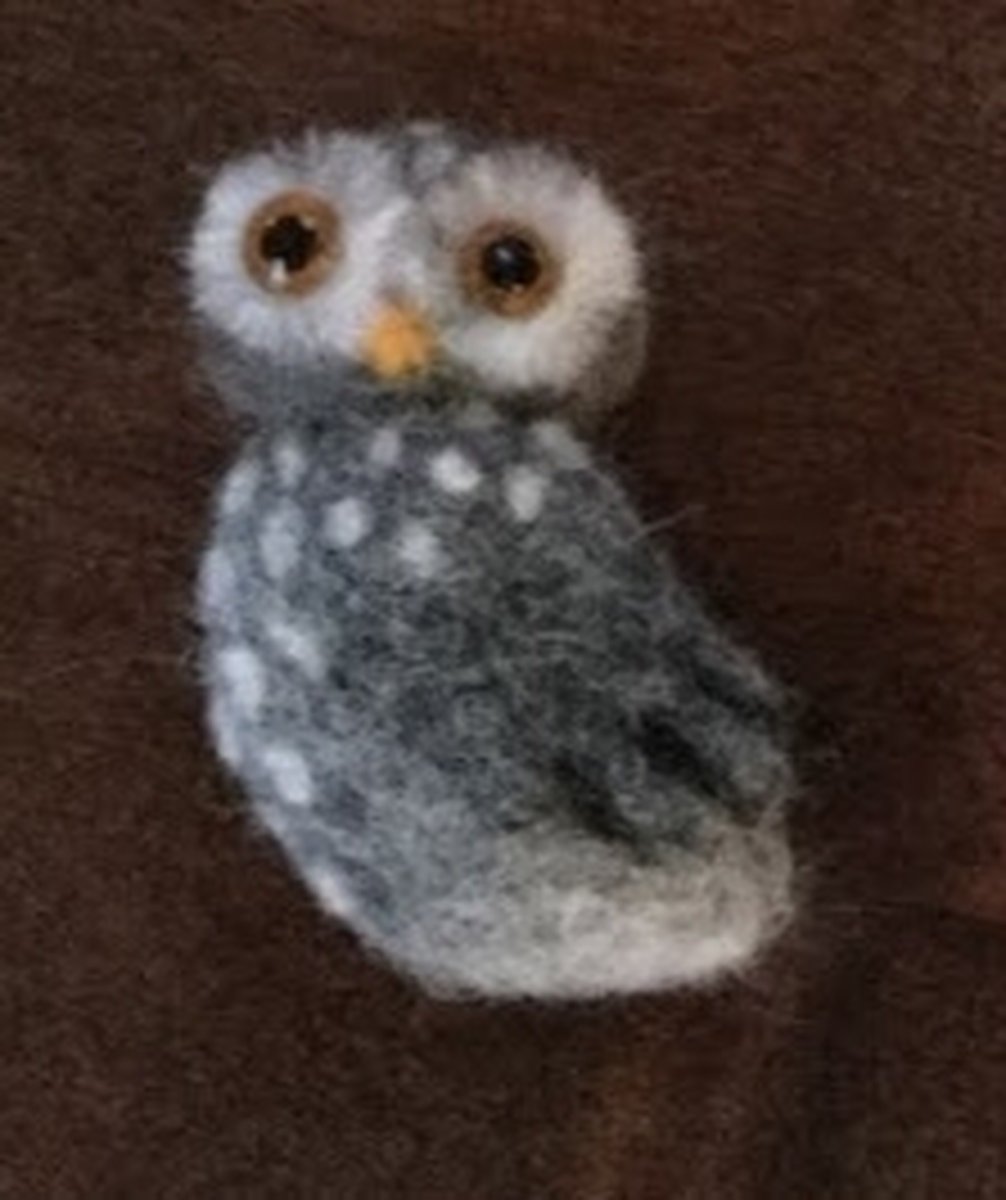 Naaldvilten, broche uil